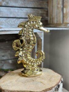 Złoty ceramiczny konik morski